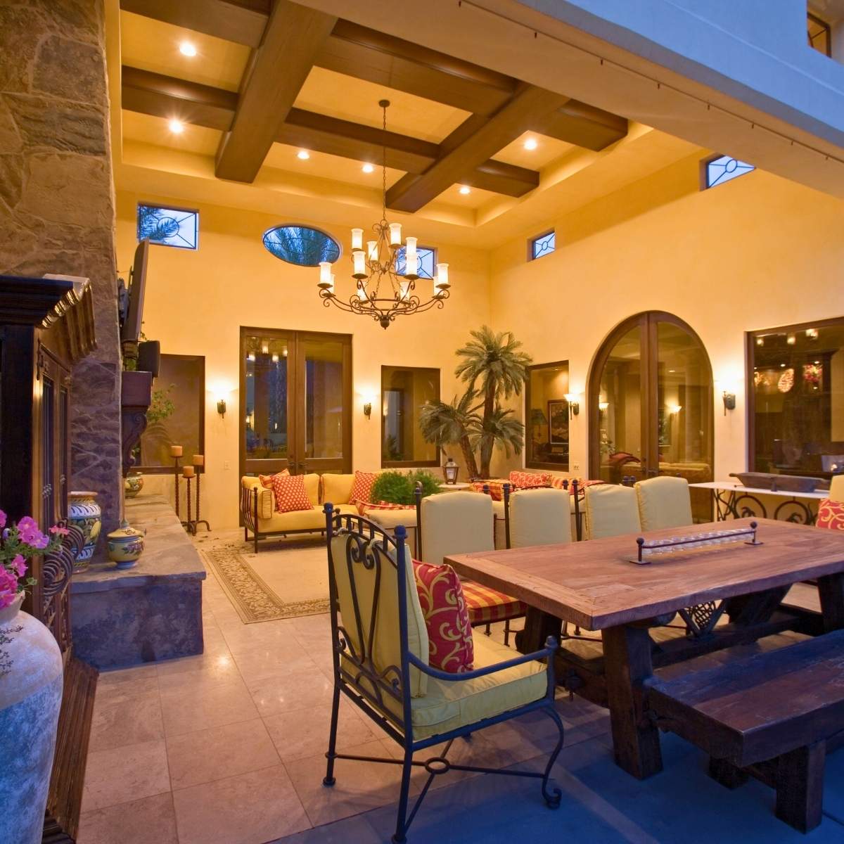 Backyard patio with candle chandelier and wood faux beams