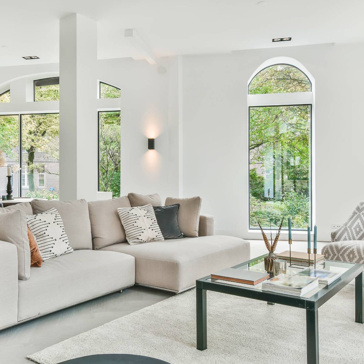 modern home interior with arched windows and white walls