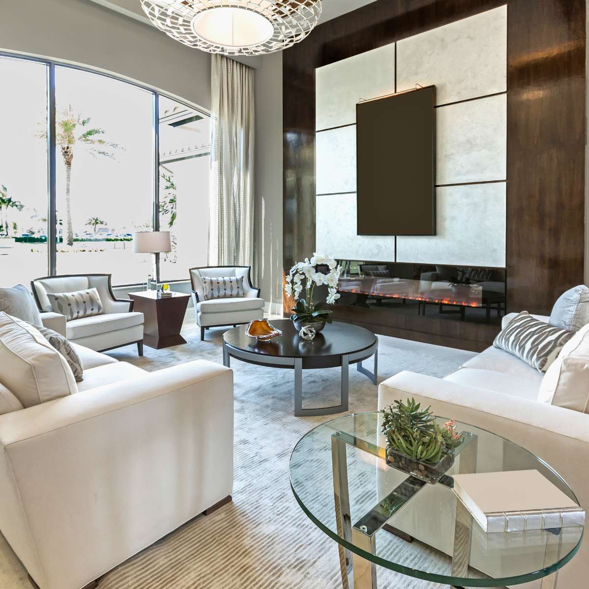 living room with white couch, fireplace, and modern wall design