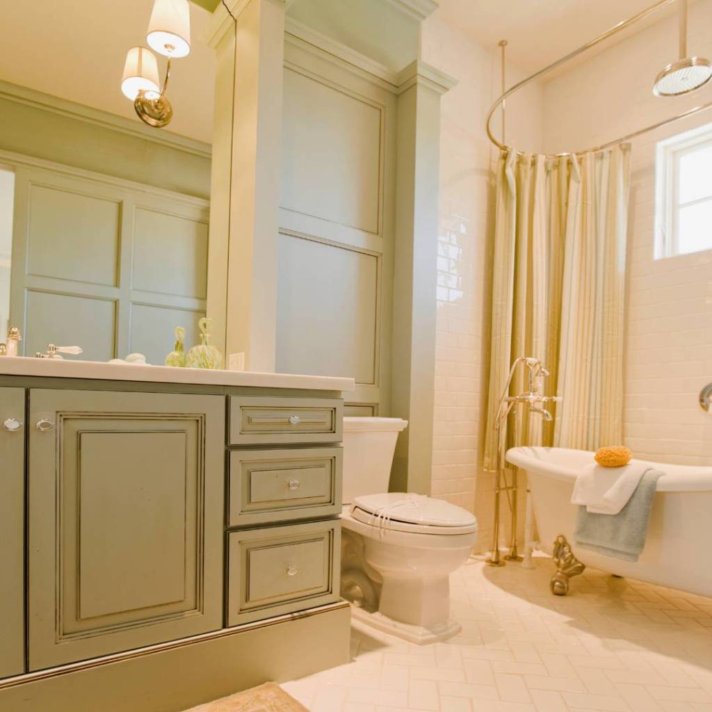 Custom Bathroom remodel plumbing with light green vanity cabinets in Orange County, California.