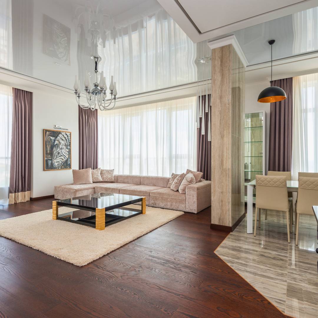 home interior with chandelier in living room and pendent lighting